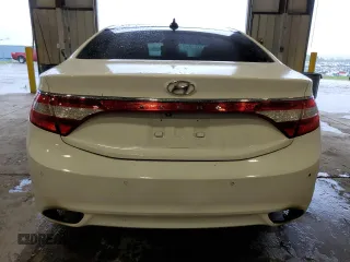 2013 Hyundai Azera z VIN KMHFH4JG0DA225049, wystawiony jako Copart lot #65530604 z przebiegiem 77 218 mil mil oraz Szkoda całkowita • Salvage title. Historia ofert i sprzedaży dostępna na DreamBid. Obrazek 6.