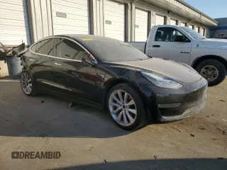2019 Tesla Model 3 Mid Range with VIN 5YJ3E1EA9KF412525, listed as a Copart auction lot 48689825 with 134,768 mi miles and Salvage Title. Bid and sale history available at DreamBid. Image 4.
