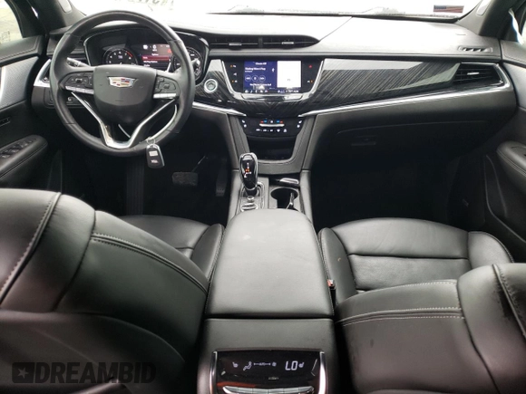 2023 Cadillac XT6 FWD Premium Luxury z VIN 1GYKPCRS5PZ101867, wystawiony jako Copart lot #51773545 z przebiegiem 31 322 mil mil oraz Szkoda całkowita • Salvage title. Historia ofert i sprzedaży dostępna na DreamBid. Obrazek 8.