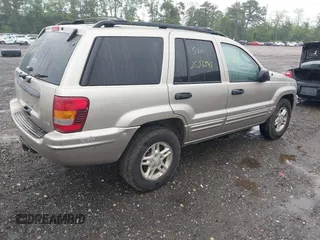 2004 Jeep Grand Cherokee Laredo with VIN 1J4GW48N24C230058, listed as a IAAI auction lot 42386914 with Not provided miles and . Bid and sale history available at DreamBid. Image 4.