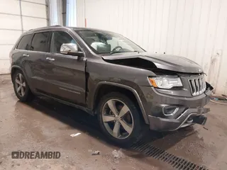 2015 Jeep Grand Cherokee Overland z VIN 1C4RJFCG1FC663469, wystawiony jako IAAI lot #41666113 z przebiegiem 140 159 mil mil oraz . Historia ofert i sprzedaży dostępna na DreamBid. Obrazek 1.