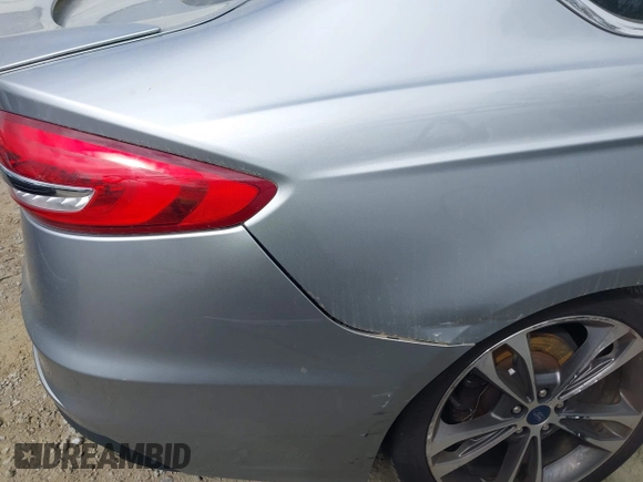 2020 Ford Fusion Titanium с VIN 3FA6P0K91LR128016, выставлен на аукционе IAAI как лот 41947905 с пробегом 79 622 миль миль и . История ставок и продаж доступна на DreamBid. Изображение 6.
