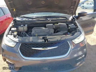 2023 Chrysler Pacifica Touring L with VIN 2C4RC1BG6PR547837, listed as a IAAI auction lot 42014739 with 59,943 mi miles. Bid and sale history available at carsss.com. Image 10.