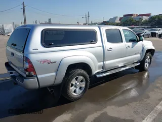 2013 Toyota Tacoma PreRunner with VIN 3TMKU4HN8DM034338, listed as a IAAI auction lot 41808842 with 142,012 mi miles and . Bid and sale history available at DreamBid. Image 4.