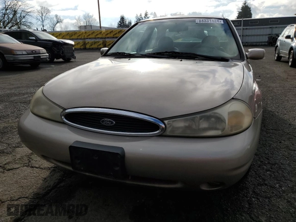 1998 Ford Contour SE z VIN 1FAFP6637WK280190, wystawiony jako Copart lot #84331424 z przebiegiem 185 754 mil mil oraz Czysty tytuł • Clean title. Historia ofert i sprzedaży dostępna na DreamBid. Obrazek 5.