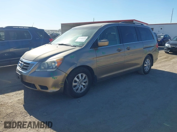 2010 Honda Odyssey EX-L with VIN 5FNRL3H79AB048049, listed as a IAAI auction lot 41440910 with 142,385 mi miles. Bid and sale history available at carsss.com. Image 2.