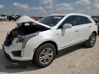 2023 Cadillac XT5 FWD Premium Luxury with VIN 1GYKNCRS7PZ150378, listed as a Copart auction lot 71792184 with 21,631 mi miles and Salvage Title. Bid and sale history available at carsss.com. Image 1.