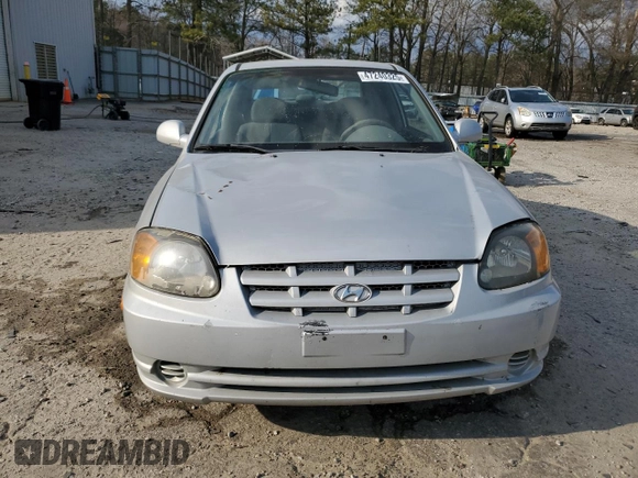 2003 Hyundai Accent GL z VIN KMHCG35CX3U270374, wystawiony jako Copart lot #47240325 z przebiegiem 122 739 mil mil oraz Szkoda całkowita • Salvage title. Historia ofert i sprzedaży dostępna na DreamBid. Obrazek 5.