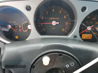 2004 Nissan 350Z Touring z VIN JN1AZ34E84T063971, wystawiony jako Copart lot #57267825 z przebiegiem 131 036 mil mil oraz Szkoda całkowita • Salvage title. Historia ofert i sprzedaży dostępna na DreamBid. Obrazek 9.