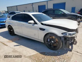 2015 BMW M5 z VIN WBSFV9C54FD594450, wystawiony jako Copart lot #52173915 z przebiegiem 67 267 mil mil oraz Szkoda całkowita • Salvage title. Historia ofert i sprzedaży dostępna na DreamBid. Obrazek 4.