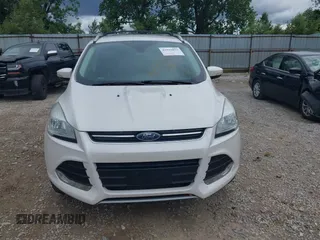 2016 Ford Escape Titanium z VIN 1FMCU9J90GUC76504, wystawiony jako IAAI lot #42552851 z przebiegiem 89 570 mil mil oraz . Historia ofert i sprzedaży dostępna na DreamBid. Obrazek 6.