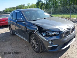2017 BMW X1 xDrive28i with VIN WBXHT3C31H5F80056, listed as a IAAI auction lot 42049925 with 64,471 mi miles. Bid and sale history available at carsss.com. Image 1.