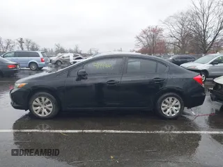 2012 Honda Civic LX with VIN 2HGFB2F5XCH605230, listed as a IAAI auction lot 41999663 with 221,815 mi miles and . Bid and sale history available at DreamBid. Image 14.