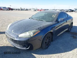 2008 Hyundai Tiburon GS z VIN KMHHM66D68U279989, wystawiony jako IAAI lot #41605072 z przebiegiem 181 870 mil mil oraz . Historia ofert i sprzedaży dostępna na DreamBid. Obrazek 2.