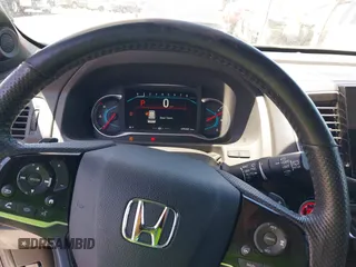2019 Honda Passport Elite z VIN 5FNYF8H05KB009575, wystawiony jako IAAI lot #42804678 z przebiegiem 70 468 mil mil oraz . Historia ofert i sprzedaży dostępna na DreamBid. Obrazek 7.