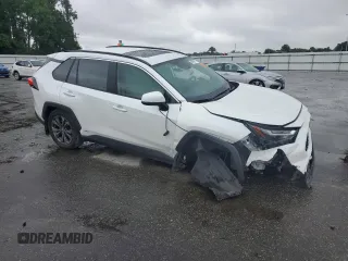 2024 Toyota RAV4 Hybrid XLE Premium with VIN 2T3B6RFV8RW074600, listed as a Copart auction lot 59560115 with 23,839 mi miles and Salvage title. Bid and sale history available at DreamBid. Image 4.