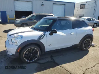 2014 MINI Paceman S with VIN WMWSS7C54EWN71981, listed as a Copart auction lot 77263444 with 84,686 mi miles and Salvage Title. Bid and sale history available at DreamBid. Image 1.