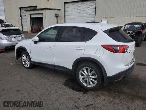 2014 Mazda CX-5 Grand Touring with VIN JM3KE4DY2E0354795, listed as a Copart auction lot 70713544 with 58,848 mi miles and Salvage Title. Bid and sale history available at DreamBid. Image 2.