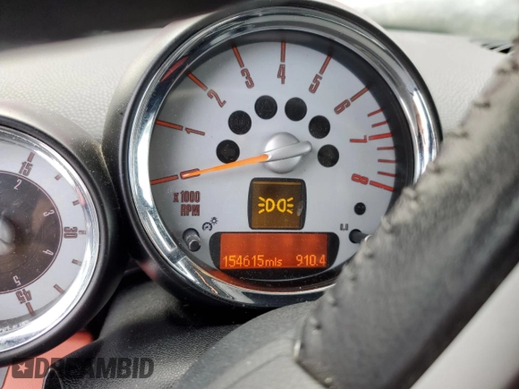 2010 MINI Convertible with VIN WMWMR3C57ATU97979, listed as a Copart auction lot 45903855 with 154,614 mi miles and Salvage Title. Bid and sale history available at DreamBid. Image 9.