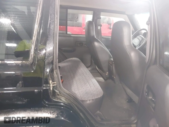 2000 Jeep Cherokee z VIN 1J4FF48S8YL216995, wystawiony jako IAAI lot #42126841 z przebiegiem 178 000 mil mil oraz . Historia ofert i sprzedaży dostępna na DreamBid. Obrazek 8.