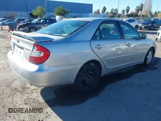 2002 Toyota Camry XLE z VIN 4T1BF30K82U506516, wystawiony jako IAAI lot #41278261 z przebiegiem 211 049 mil mil oraz . Historia ofert i sprzedaży dostępna na DreamBid. Obrazek 4.