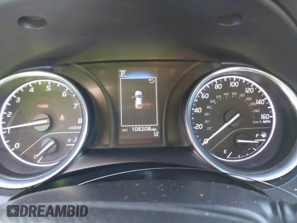 2020 Toyota Camry LE with VIN 4T1C11AKXLU986310, listed as a IAAI auction lot 40977100 with 108,208 mi miles and . Bid and sale history available at DreamBid. Image 7.