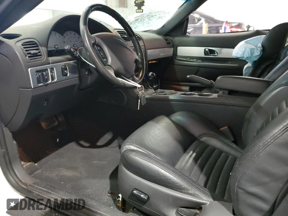 2002 Ford Thunderbird Hardtop Premium with VIN 1FAHP60A32Y125580, listed as a Copart auction lot 77493514 with 74,619 mi miles and Salvage Title. Bid and sale history available at DreamBid. Image 7.