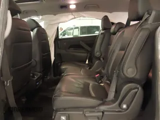 2021 Honda Odyssey Touring with VIN 5FNRL6H82MB025923, listed as a IAAI auction lot 42104290 with 61,178 mi miles and . Bid and sale history available at DreamBid. Image 8.