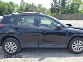 2014 Mazda CX-5 Sport with VIN JM3KE2BE3E0405976, listed as a IAAI auction lot 42161069 with 66,301 mi miles and . Bid and sale history available at carsss.com. Image 13.