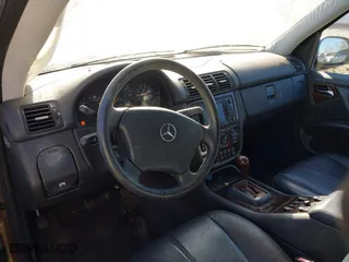 2001 Mercedes-Benz M-Class with VIN 4JGAB72E51A247926, listed as a IAAI auction lot 41277111 with 208,817 mi miles. Bid and sale history available at carsss.com. Image 13.