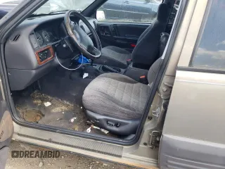 1997 Jeep Grand Cherokee Laredo z VIN 1J4GZ58S4VC502596, wystawiony jako Copart lot #88255865 z przebiegiem Nie podano mil oraz Nie do naprawy • Non repairable. Historia ofert i sprzedaży dostępna na DreamBid. Obrazek 7.