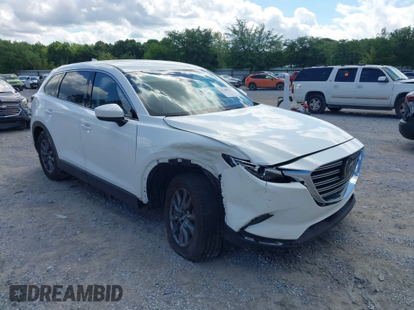 2022 Mazda CX-9 Touring z VIN JM3TCBCY7N0600787, wystawiony jako IAAI lot #42240512 z przebiegiem 27 927 mil mil oraz . Historia ofert i sprzedaży dostępna na DreamBid. Obrazek 1.