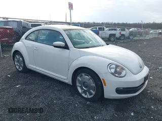 2014 Volkswagen Beetle 2.5L w/Sun with VIN 3VWJP7AT8EM611560, listed as a IAAI auction lot 41488488 with 140,798 mi miles and . Bid and sale history available at DreamBid. Image 1.