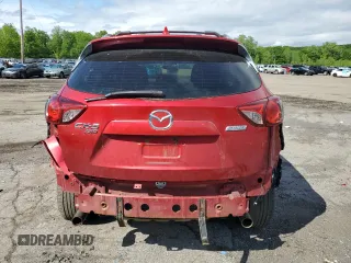2015 Mazda CX-5 Sport with VIN JM3KE4BY9F0479748, listed as a Copart auction lot 58847805 with 122,698 mi miles and Salvage title. Bid and sale history available at DreamBid. Image 6.