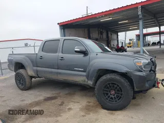 2014 Toyota Tacoma z VIN 3TMMU4FN9EM066292, wystawiony jako IAAI lot #41542492 z przebiegiem 122 308 mil mil oraz . Historia ofert i sprzedaży dostępna na DreamBid. Obrazek 12.