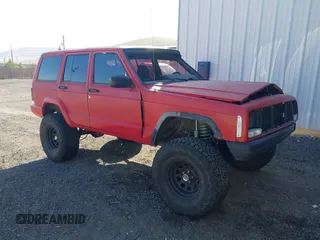 1997 Jeep Cherokee SE z VIN 1J4FJ28S1VL556827, wystawiony jako IAAI lot #42089112 z przebiegiem 179 920 mil mil oraz . Historia ofert i sprzedaży dostępna na DreamBid. Obrazek 1.