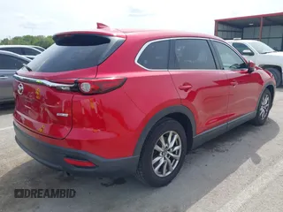 2016 Mazda CX-9 Touring with VIN JM3TCACY4G0112961, listed as a IAAI auction lot 42094718 with 114,679 mi miles and . Bid and sale history available at DreamBid. Image 4.