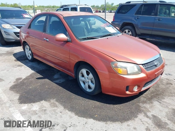 2009 Kia Spectra EX with VIN KNAFE221195026956, listed as a IAAI auction lot 42019309 with 121,341 mi miles. Bid and sale history available at carsss.com. Image 1.