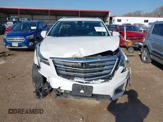 2017 Cadillac XT5 Premium Luxury AWD z VIN 1GYKNERS3HZ284561, wystawiony jako IAAI lot #41887147 z przebiegiem 119 189 mil mil oraz . Historia ofert i sprzedaży dostępna na DreamBid. Obrazek 13.