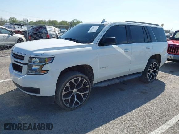 2015 Chevrolet Tahoe LT with VIN 1GNSCBKCXFR552071, listed as a IAAI auction lot 41972157 with 214,738 mi miles and . Bid and sale history available at DreamBid. Image 2.