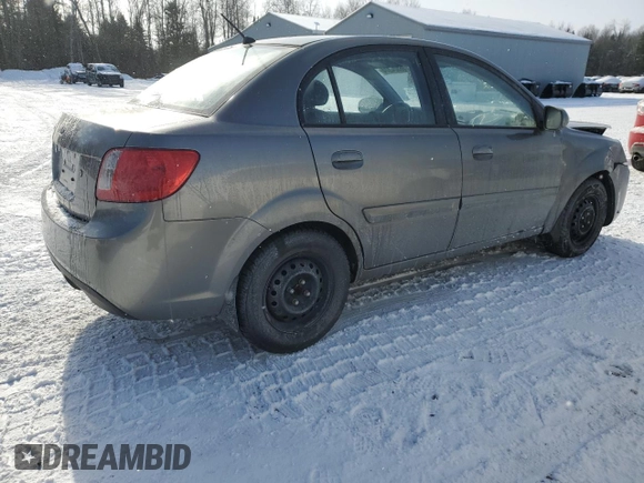 2011 Kia Rio with VIN KNADH4B32B6915325, listed as a Copart auction lot 86824074 with 167,410 mi miles and Salvage Title. Bid and sale history available at DreamBid. Image 3.