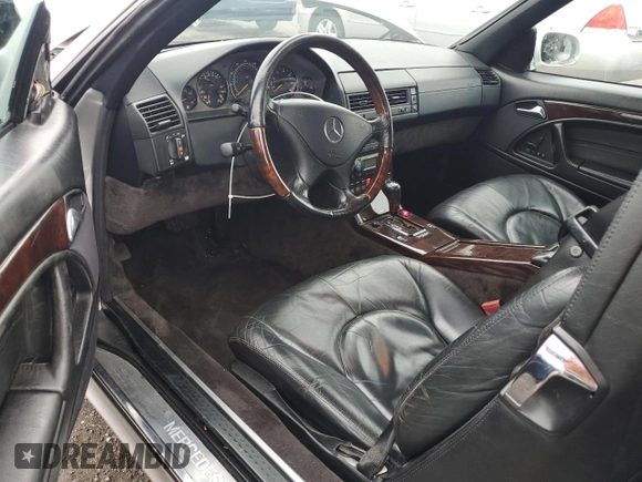 1999 Mercedes-Benz SL 500 with VIN WDBFA68F1XF177603, listed as a Copart auction lot 58983485 with 120,737 mi miles and Salvage title. Bid and sale history available at DreamBid. Image 8.