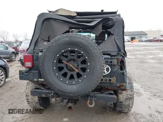 2008 Jeep Wrangler Unlimited X with VIN 1J4GA39138L641138, listed as a IAAI auction lot 41986230 with 215,026 mi miles. Bid and sale history available at carsss.com. Image 17.