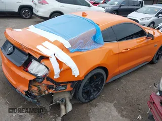2021 Ford Mustang EcoBoost with VIN 1FA6P8TD5M5151336, listed as a IAAI auction lot 41916198 with 58,990 mi miles and . Bid and sale history available at DreamBid. Image 4.