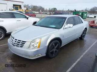 2006 Cadillac DTS w/1SC with VIN 1G6KD57Y56U101903, listed as a IAAI auction lot 41710160 with 151,057 mi miles. Bid and sale history available at carsss.com. Image 2.