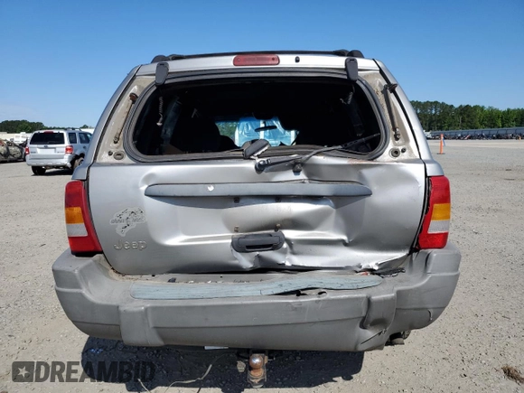2000 Jeep Grand Cherokee Laredo with VIN 1J4G248S7YC321298, listed as a Copart auction lot 58036255 with 292,779 mi miles and Salvage title. Bid and sale history available at DreamBid. Image 6.