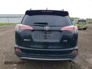 2018 Toyota RAV4 XLE with VIN 2T3WFREV0JW484430, listed as a Copart auction lot 55878455 with 132,335 mi miles and Salvage title. Bid and sale history available at DreamBid. Image 6.