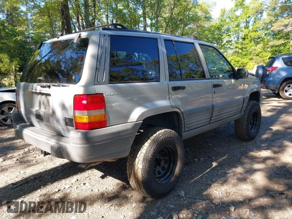1998 Jeep Grand Cherokee Laredo with VIN 1J4GZ58S6WC154415, listed as a IAAI auction lot 42331831 with 163,723 mi miles and . Bid and sale history available at DreamBid. Image 4.