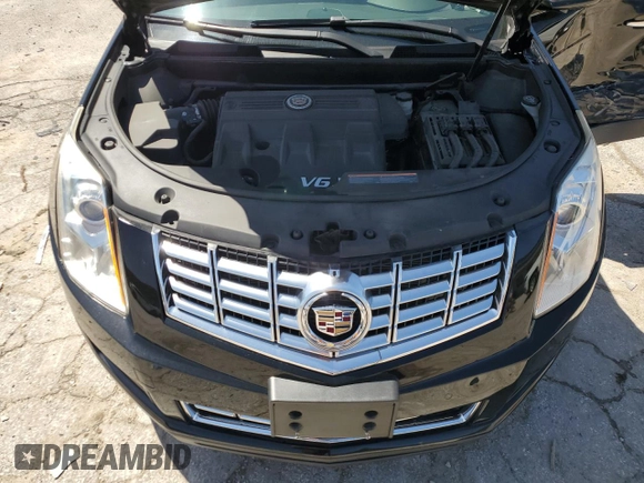 2014 Cadillac SRX Luxury Collection z VIN 3GYFNEE32ES647165, wystawiony jako Copart lot #52331335 z przebiegiem 27 277 mil mil oraz Szkoda całkowita • Salvage title. Historia ofert i sprzedaży dostępna na DreamBid. Obrazek 13.