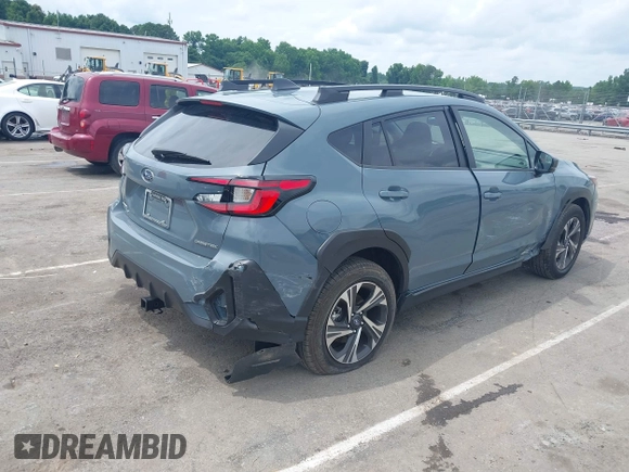 2024 Subaru Crosstrek Premium z VIN JF2GUADC7R8299418, wystawiony jako IAAI lot #42358005 z przebiegiem 21 690 mil mil oraz . Historia ofert i sprzedaży dostępna na DreamBid. Obrazek 4.